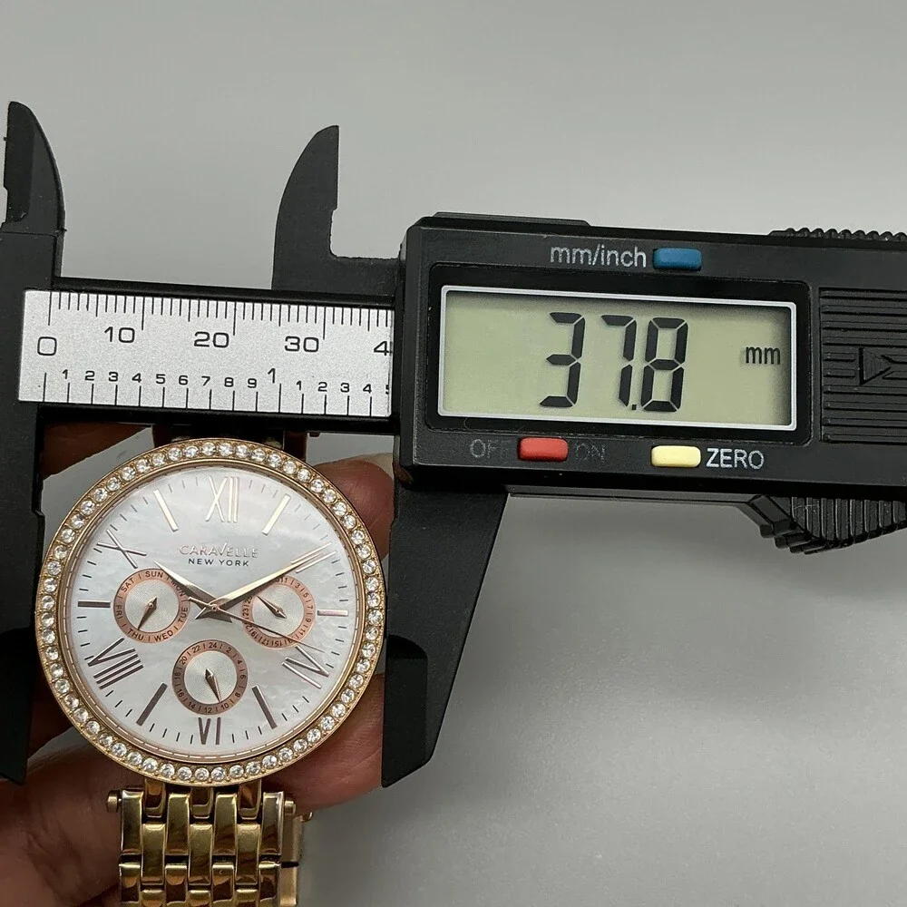 Caravelle New York Womens Watch 38mm MOP Gold Tone Day Date New Battery 5.75
